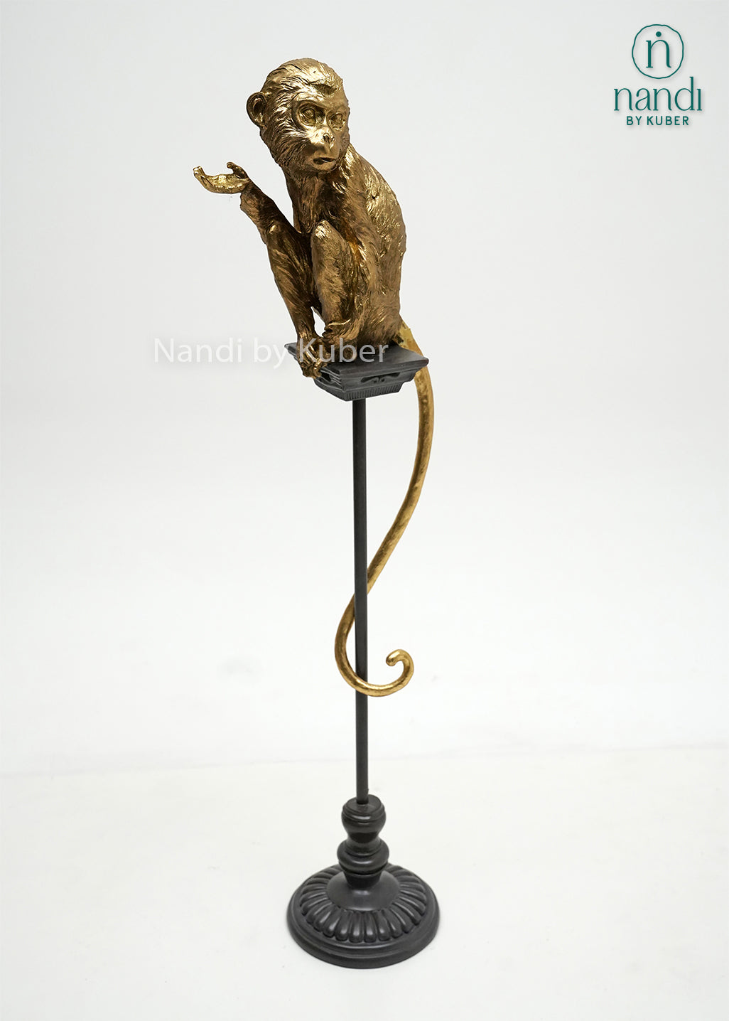 Decorative monkey figurine on a stand with an antique gold finish, bringing personality, charm, and artistic elegance to any interior space.