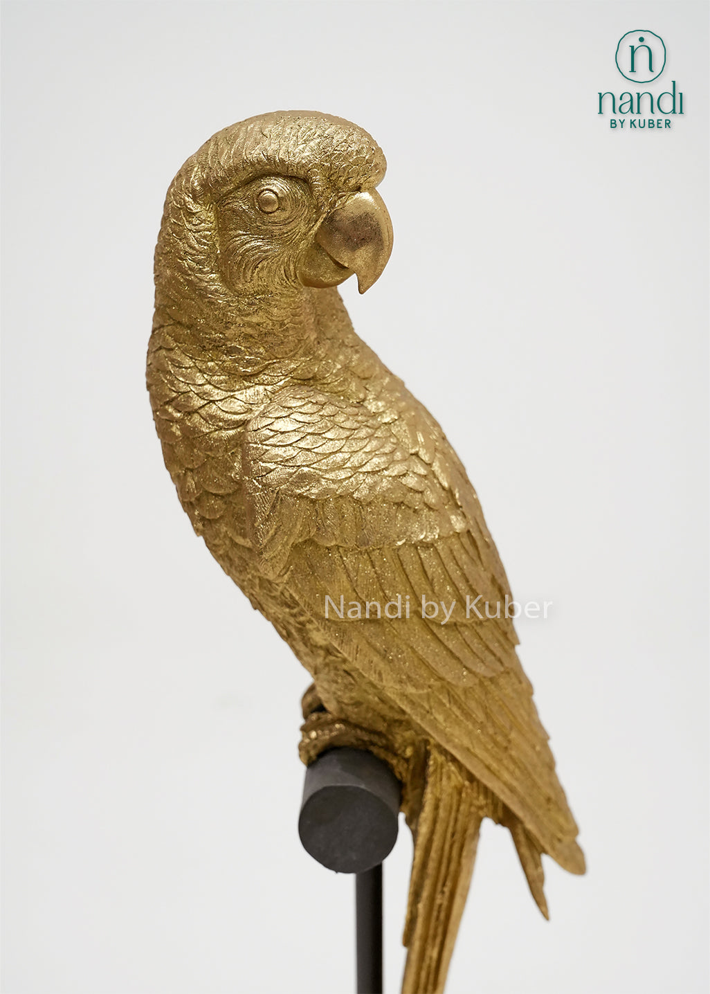 Decorative parrot figurine on a stand with detailed craftsmanship and an antique gold finish, bringing elegance and vibrant charm to any space.