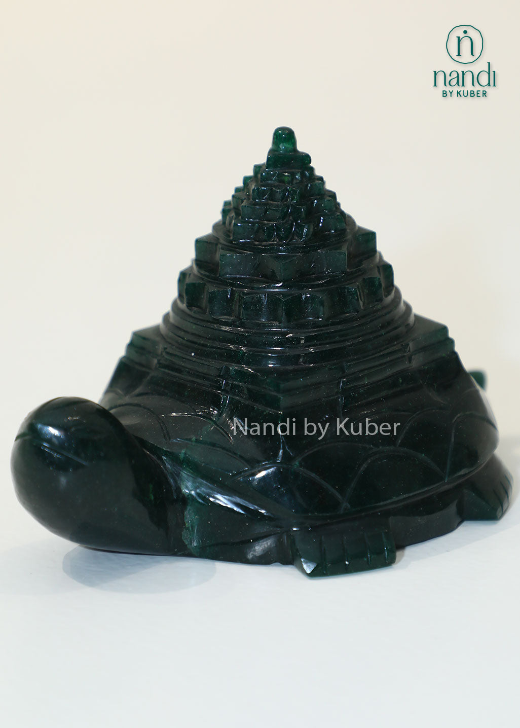 Green jade stone tortoise with Shri Yantra carving, Vastu and Feng Shui prosperity symbol for wealth, positive energy, home décor, office desk decoration, and spiritual gifting.