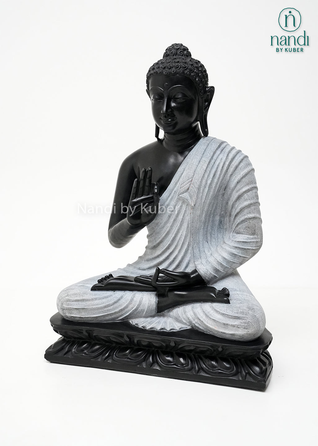 Handcrafted black and white Buddha meditation statue with lotus base, spiritual marble-look sculpture for home décor, meditation spaces, living rooms, and gifting.