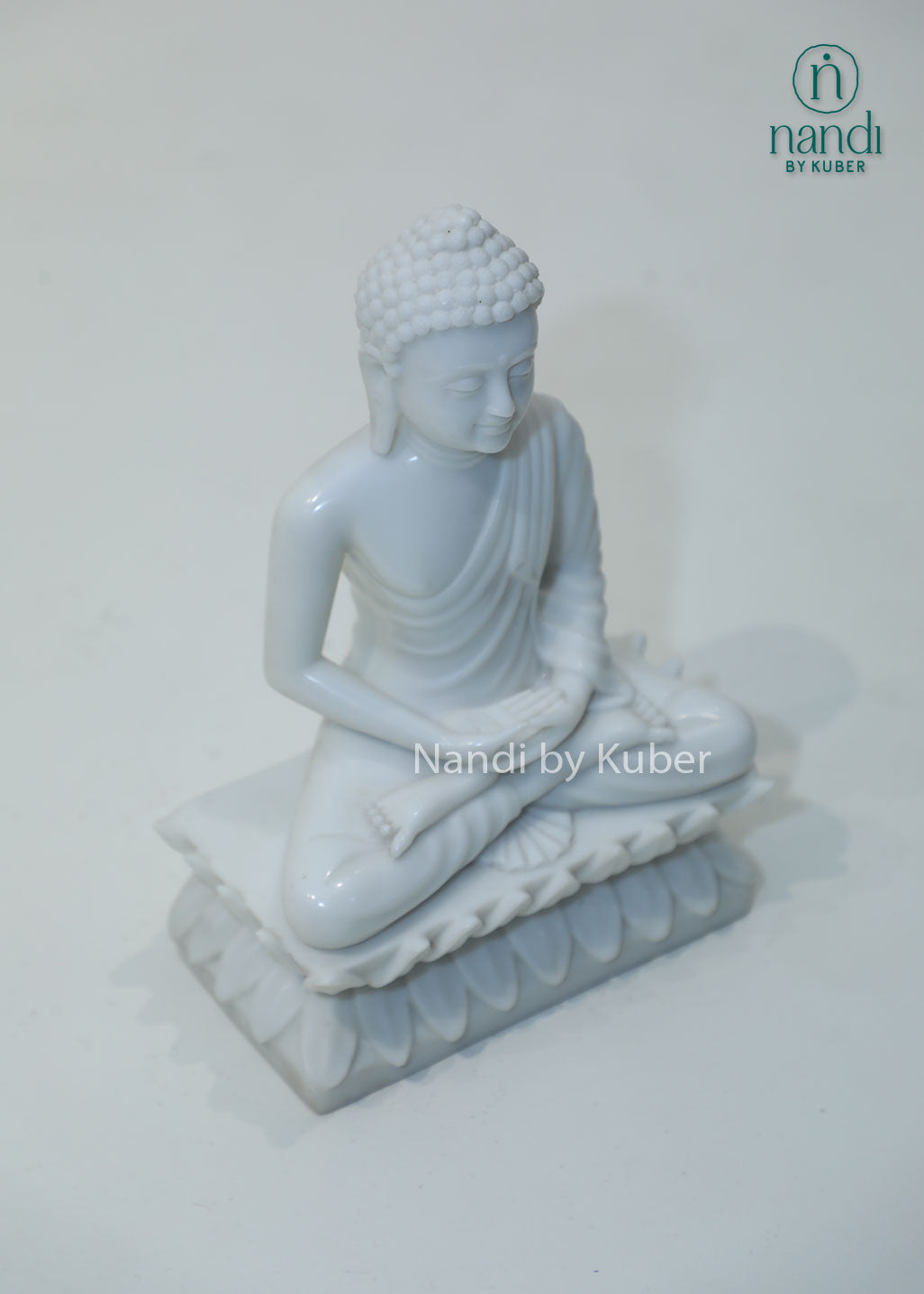White marble Buddha meditation statue on lotus base for home décor, meditation room, yoga studio, spiritual healing, mindfulness practice, Zen décor, positive energy, Vastu, and peaceful interior styling.