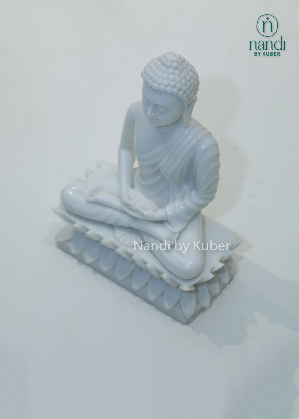 White marble Buddha meditation statue on lotus base for home décor, meditation room, yoga studio, spiritual healing, mindfulness practice, Zen décor, positive energy, Vastu, and peaceful interior styling.