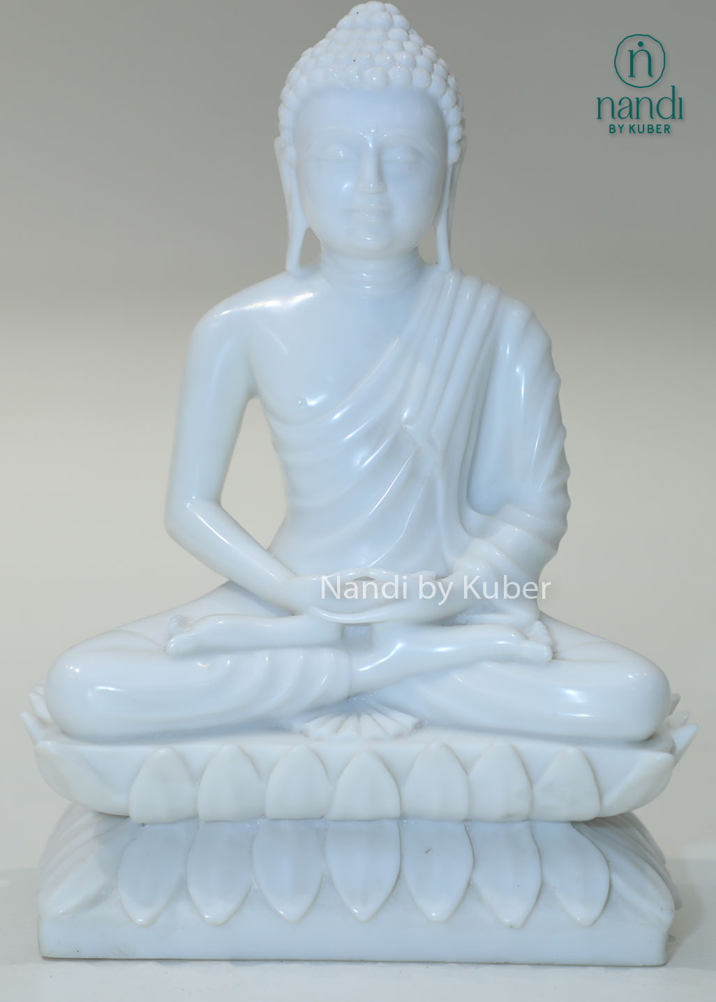 White marble Buddha meditation statue on lotus base for home décor, meditation room, yoga studio, spiritual healing, mindfulness practice, Zen décor, positive energy, Vastu, and peaceful interior styling.