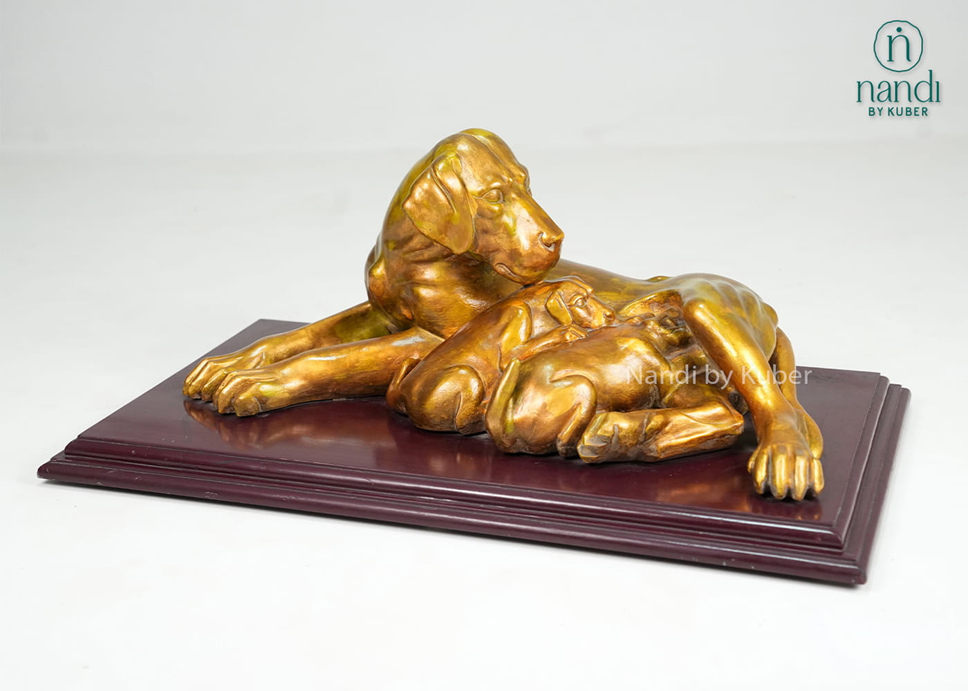 Marble dog and puppy sculpture on wooden display base