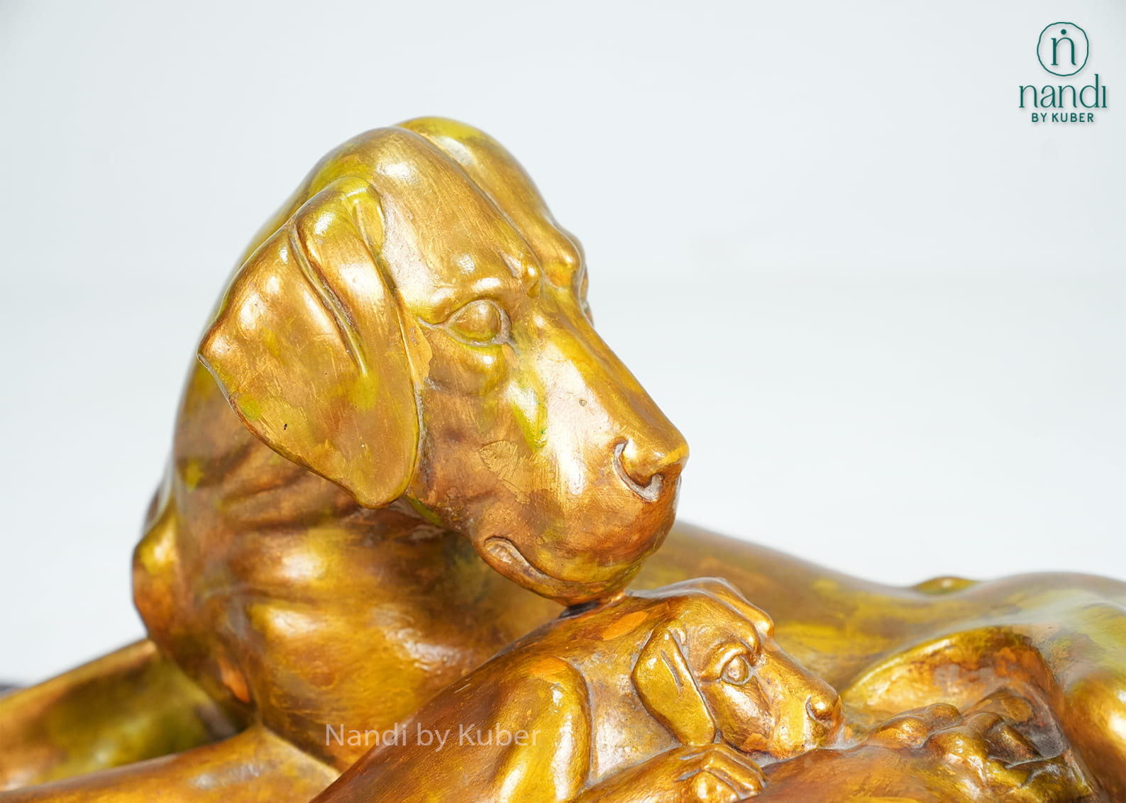 Marble dog and puppy sculpture on wooden display base