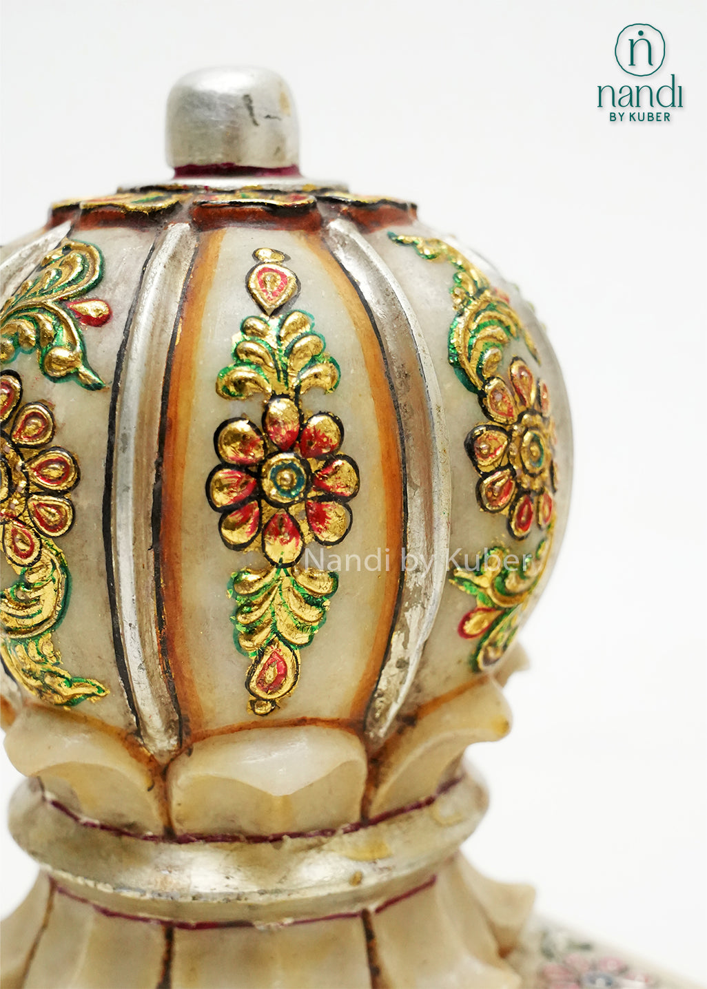 Set of two decorative marble door stoppers with intricate floral hand-painting, embossed detailing, and gold embellishments, ideal for luxury home décor and traditional Indian interiors.