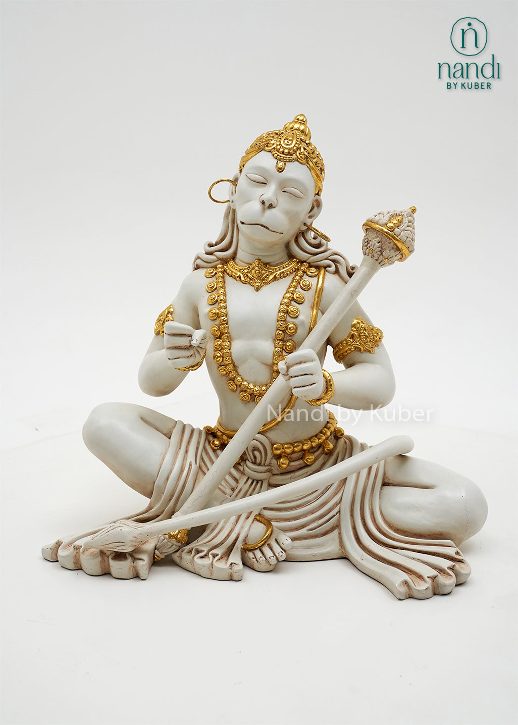 Handcrafted marble dust Hanuman idol in dhyan mudra with gold embellishments and ceremonial mace, ideal for meditation spaces, home temples, spiritual décor, and devotional gifting.
