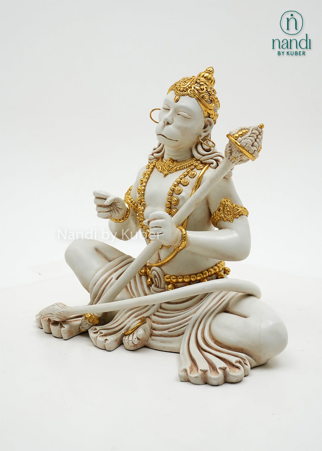 Handcrafted marble dust Hanuman idol in dhyan mudra with gold embellishments and ceremonial mace, ideal for meditation spaces, home temples, spiritual décor, and devotional gifting.