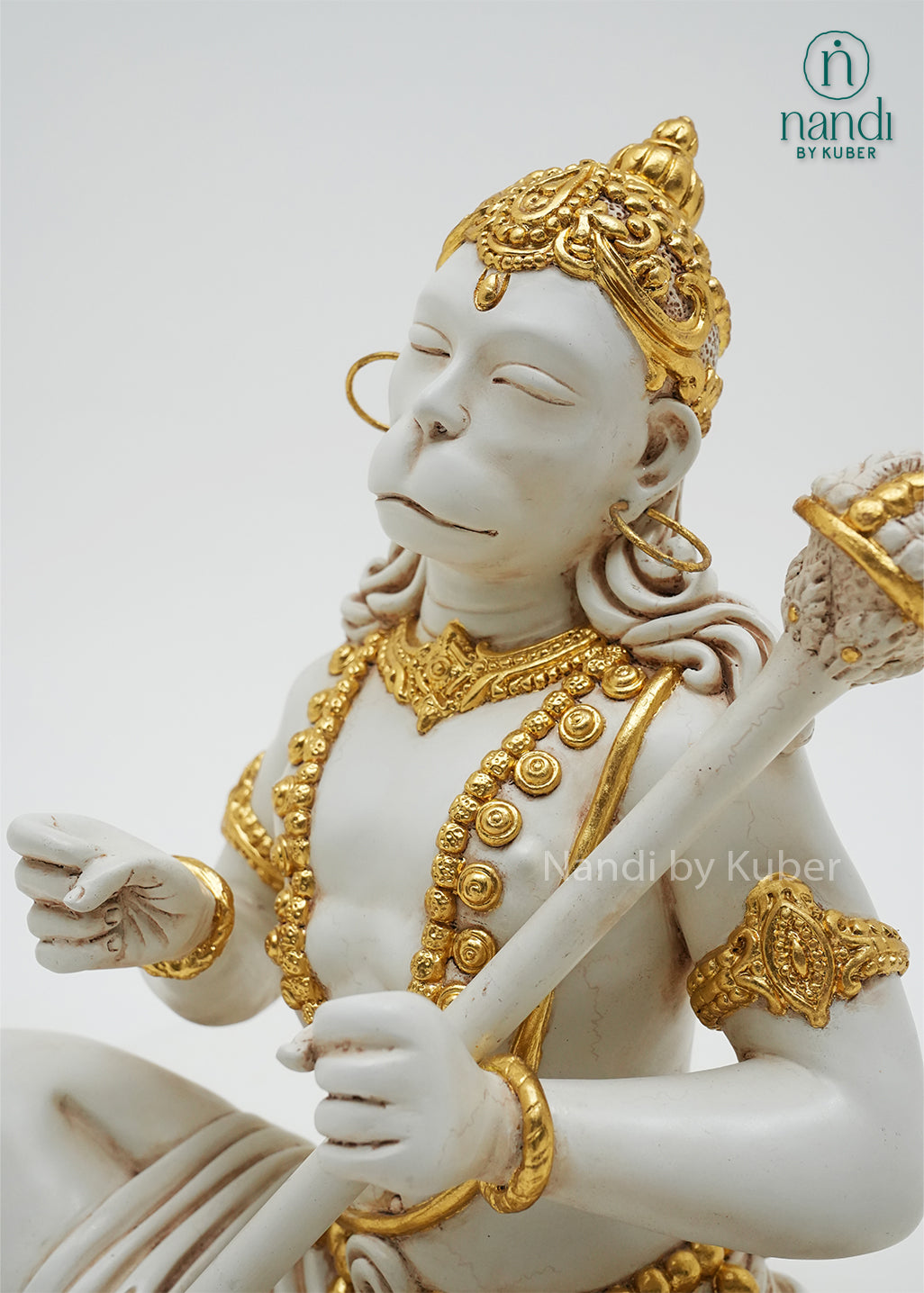 Handcrafted marble dust Hanuman idol in dhyan mudra with gold embellishments and ceremonial mace, ideal for meditation spaces, home temples, spiritual décor, and devotional gifting.