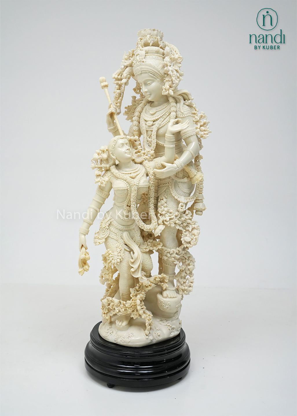 Elegant Radha Krishna sculpture with decorative base, symbolizing divine love, harmony, and devotion while enhancing any sacred or decorative space.