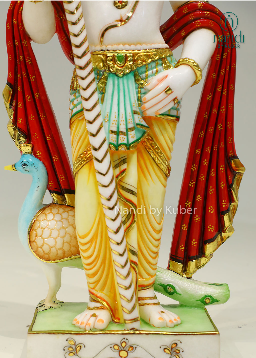 Handcrafted marble statue of Lord Kartikeya (Murugan Swami) with his sacred peacock, beautifully detailed and ideal for devotional and spiritual décor.