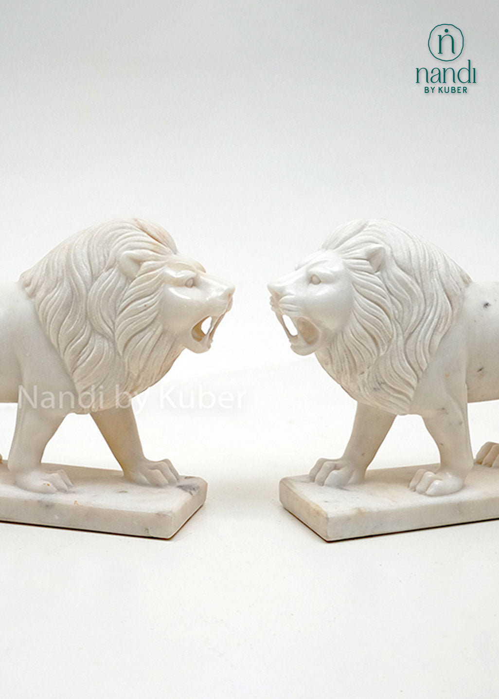 Set of two white marble lion figurines with detailed carving, decorative guardian lion statues for home décor, office display, entrance décor, and luxury gifting.