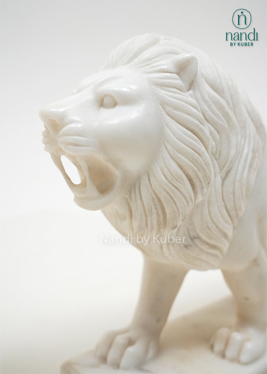Set of two white marble lion figurines with detailed carving, decorative guardian lion statues for home décor, office display, entrance décor, and luxury gifting.