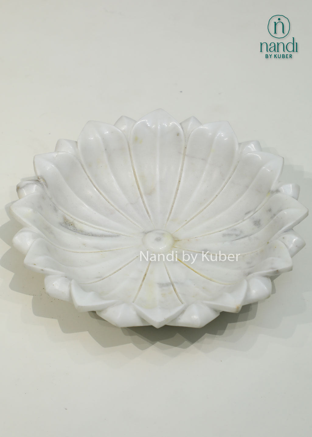 Handcrafted marble lotus urli with a graceful floral design, ideal for floating flowers, candles, and elegant decorative displays.