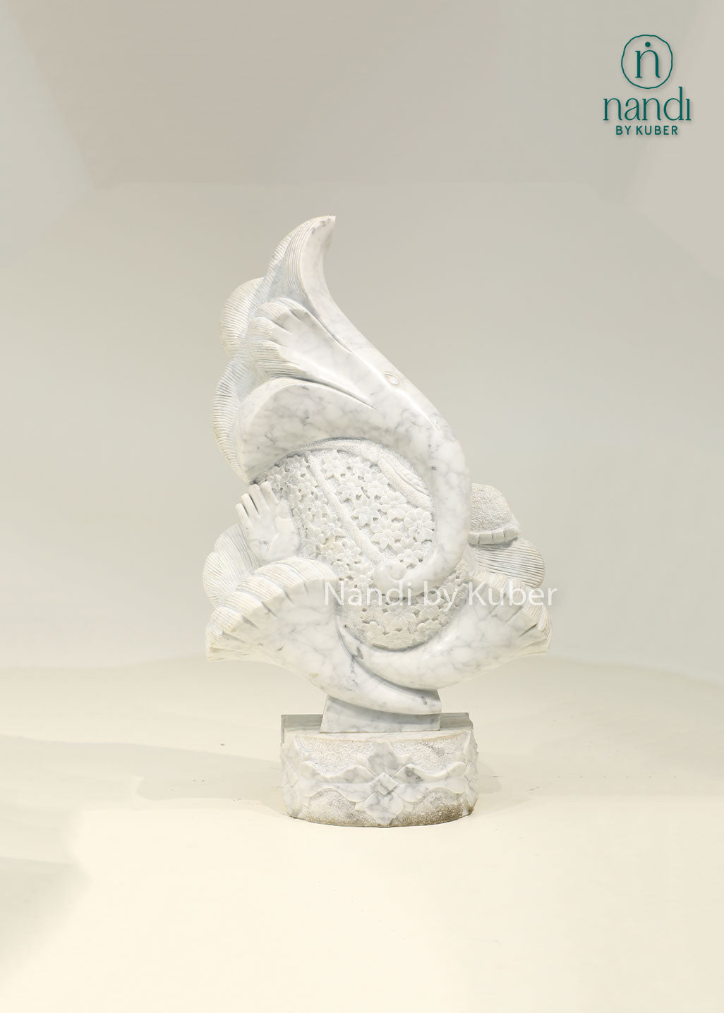 Modern marble Ganesha sculpture with an artistic abstract design, symbolizing wisdom, prosperity, and timeless elegance.