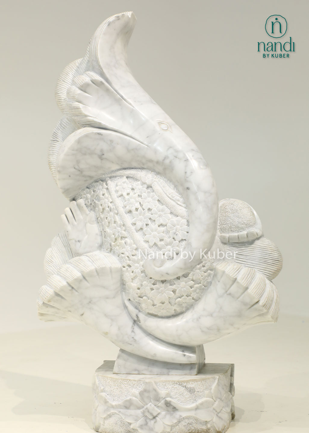 Modern marble Ganesha sculpture with an artistic abstract design, symbolizing wisdom, prosperity, and timeless elegance.