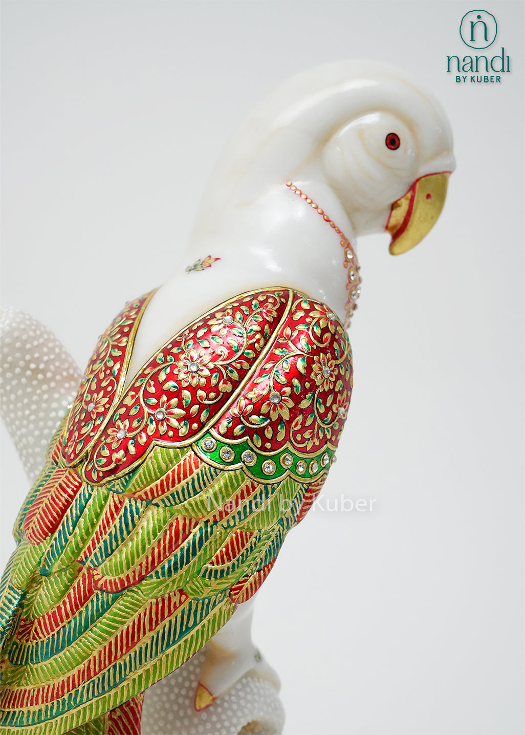 Handcrafted marble parrot statue with colorful hand-painted floral detailing and decorative branch stand, ideal for home décor, bird figurine collections, gifting, and luxury interior decoration.