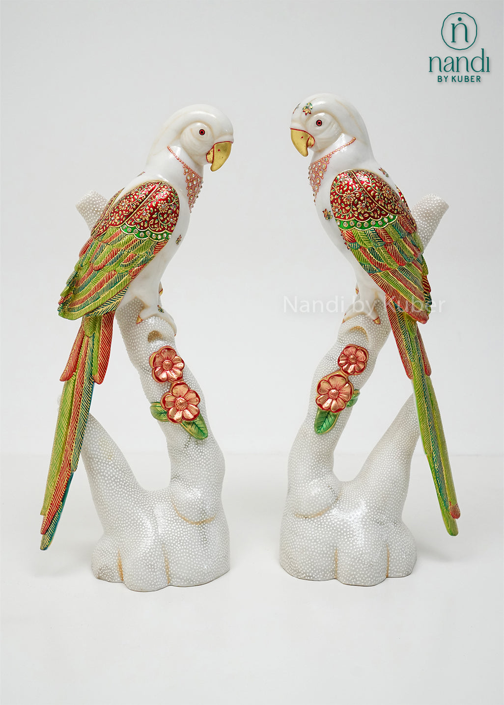 Handcrafted marble parrot statue with colorful hand-painted floral detailing and decorative branch stand, ideal for home décor, bird figurine collections, gifting, and luxury interior decoration.