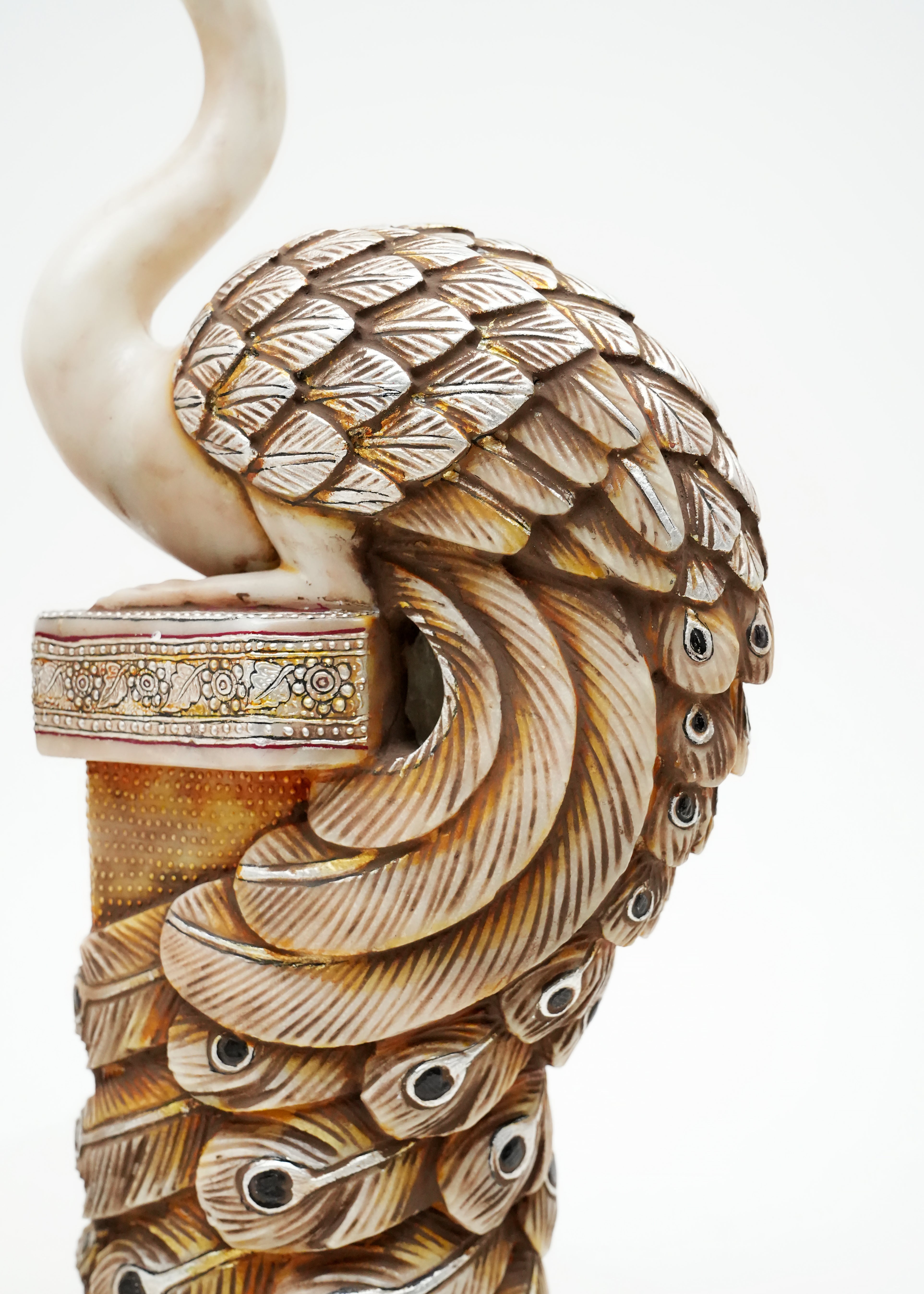 Decorative peacock pillar sculpture pair with intricate antique detailing, symbolizing beauty, prosperity, and timeless elegance.