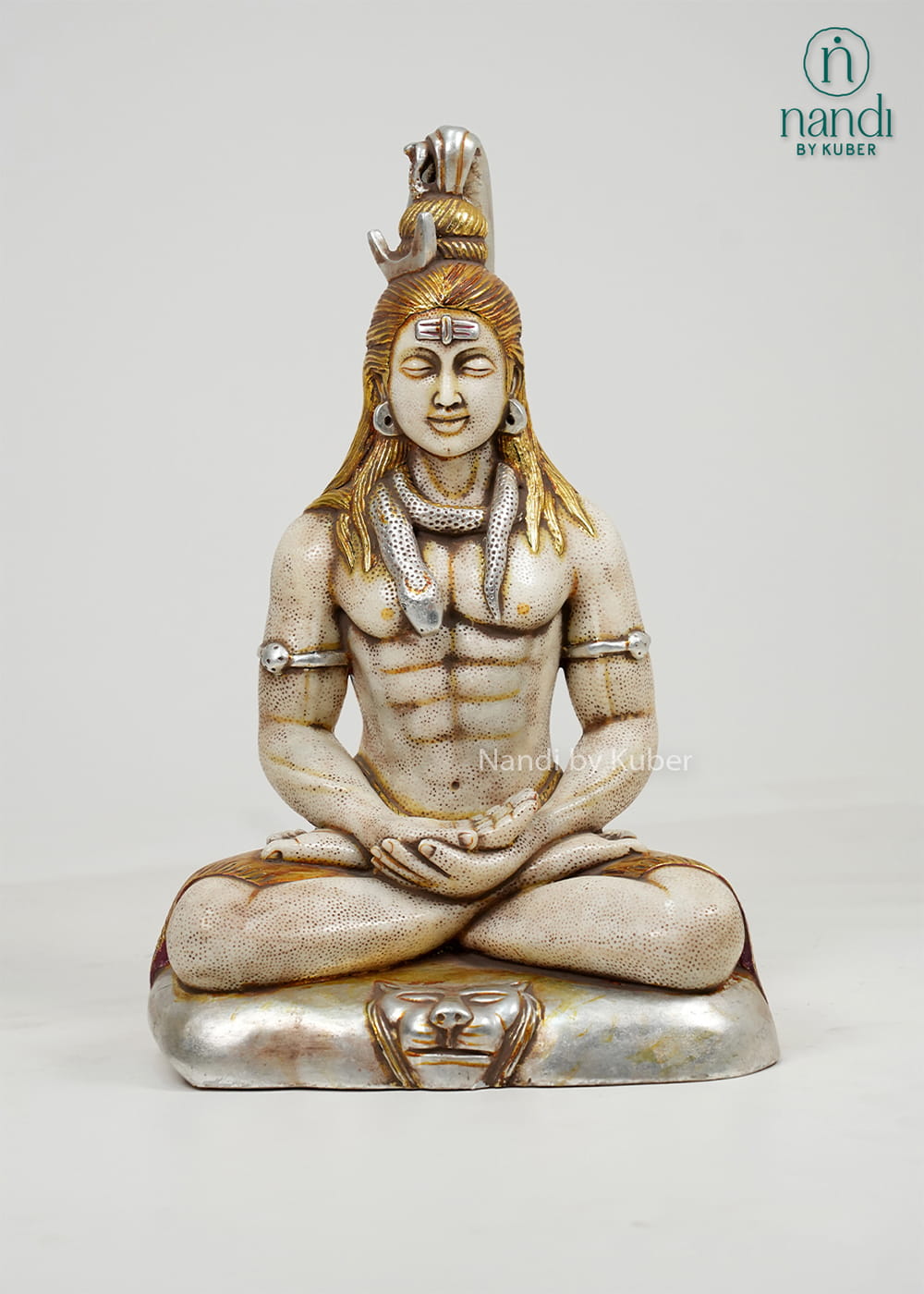 White marble-style Lord Shiva statue in a meditative pose with sacred adornments, antique gold accents, and a decorative pedestal base.