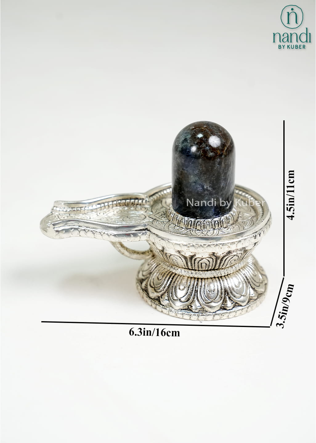 Semi-precious stone Shiva Lingam on ornate metal pedestal base