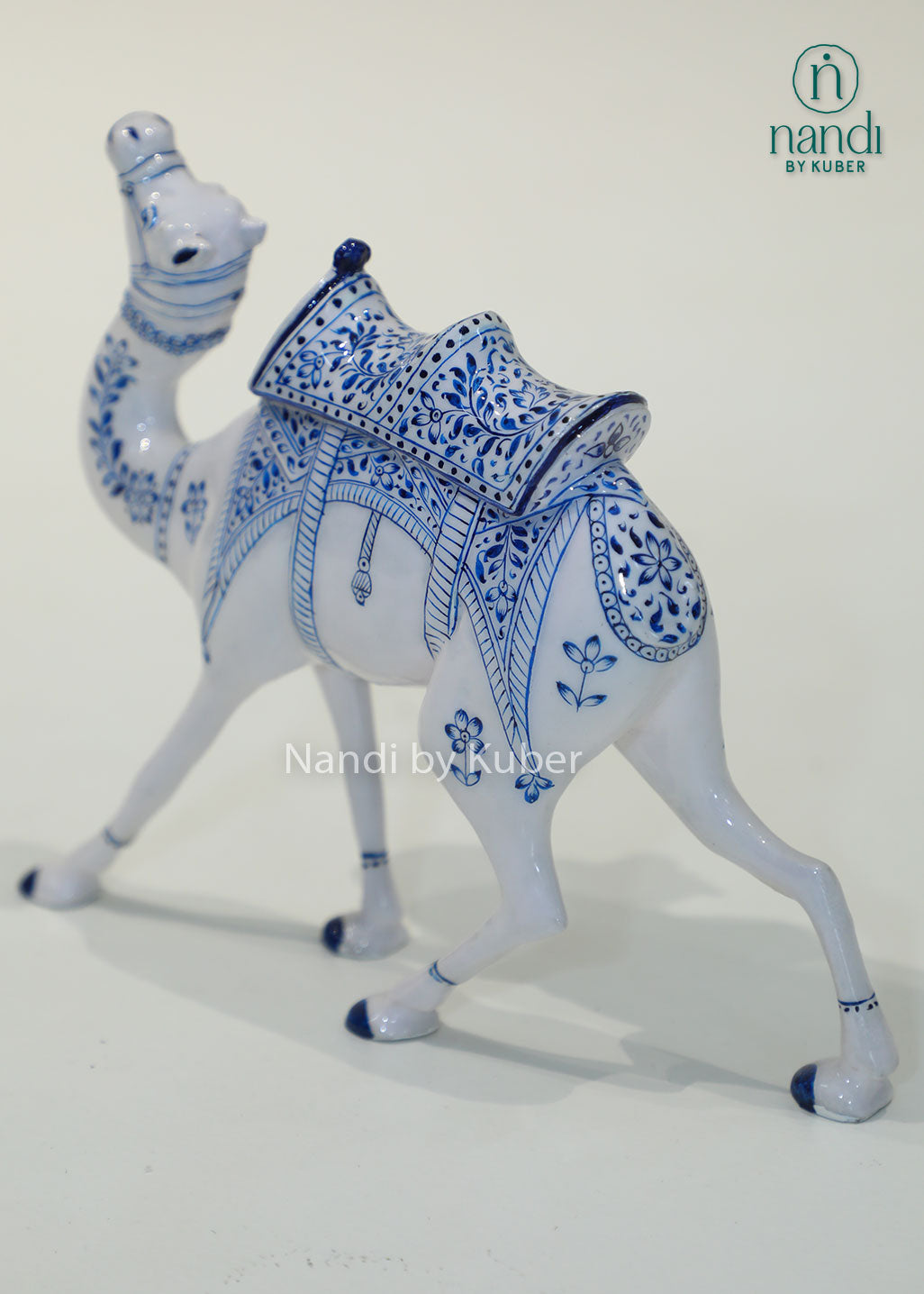 Handcrafted camel figurine with traditional blue pottery-inspired detailing, perfect for adding cultural elegance and artistic charm to any décor space.