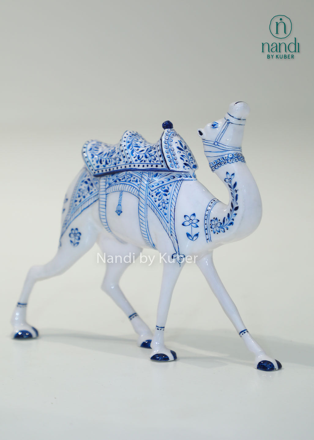 Handcrafted camel figurine with traditional blue pottery-inspired detailing, perfect for adding cultural elegance and artistic charm to any décor space.
