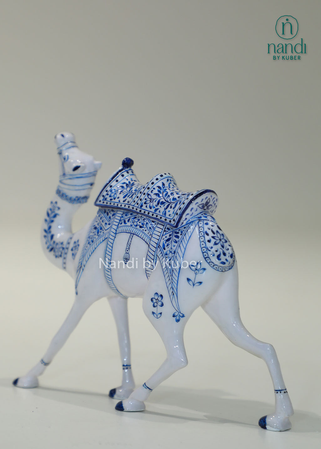 Handcrafted camel figurine with traditional blue pottery-inspired detailing, perfect for adding cultural elegance and artistic charm to any décor space.