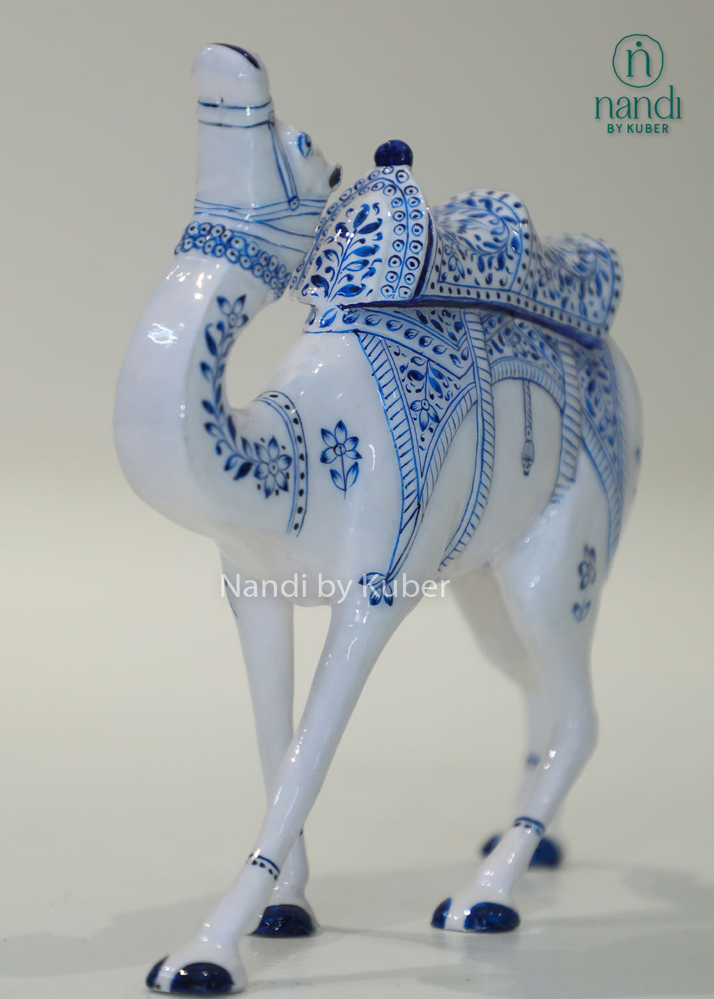 Handcrafted camel figurine with traditional blue pottery-inspired detailing, perfect for adding cultural elegance and artistic charm to any décor space.