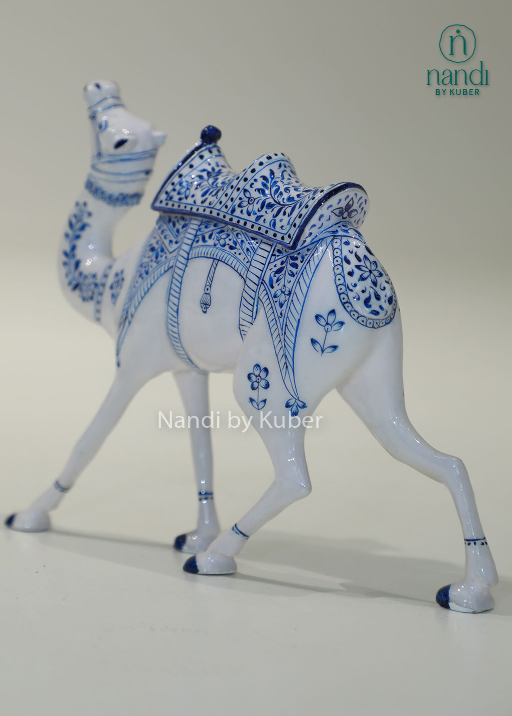Handcrafted camel figurine with traditional blue pottery-inspired detailing, perfect for adding cultural elegance and artistic charm to any décor space.