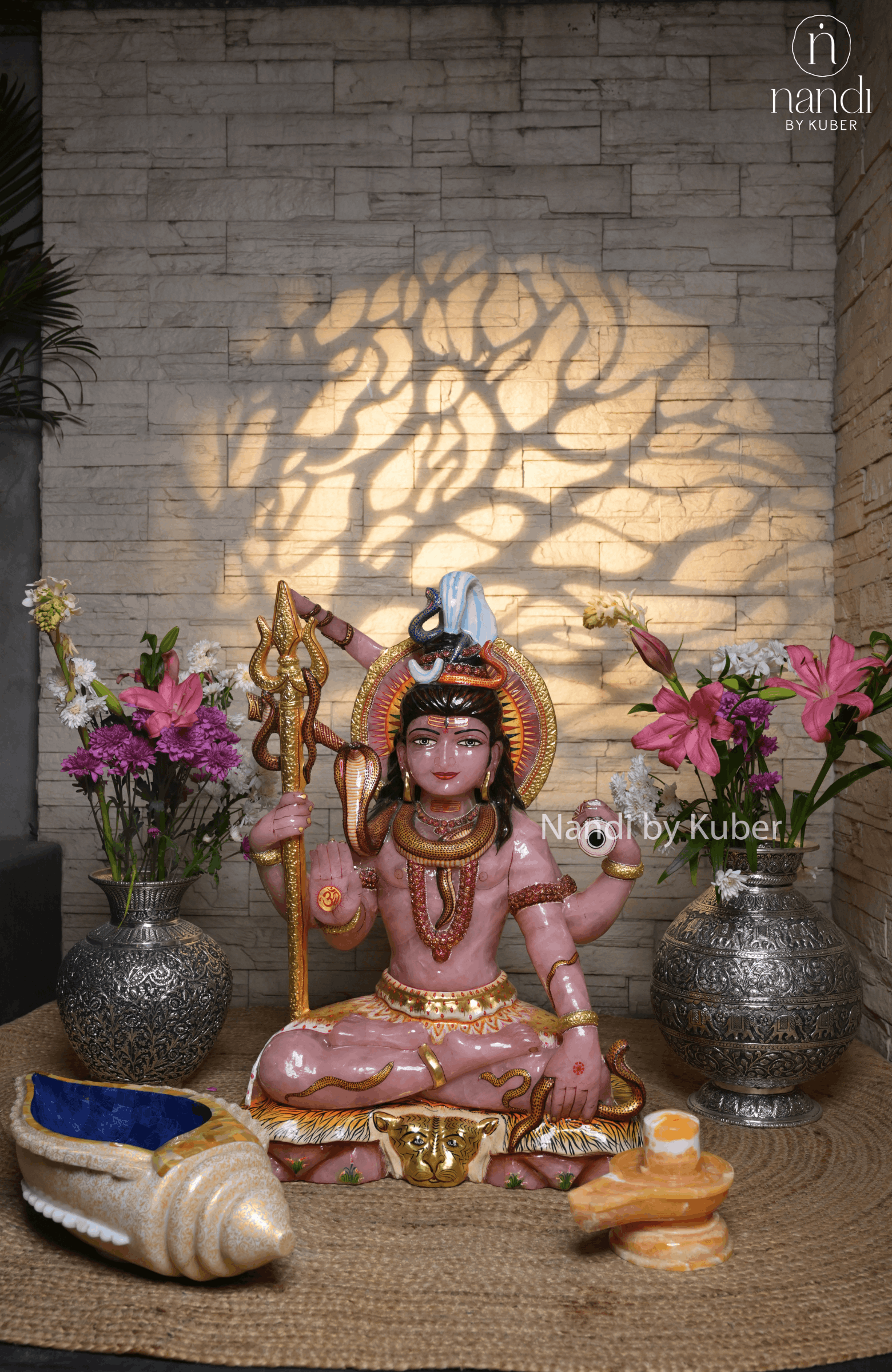 Rose quartz Lord Shiva statue with trident, serpent detailing, and gold accents