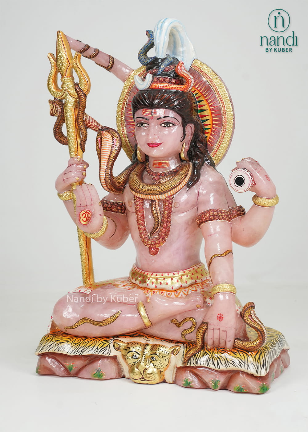 Rose quartz Lord Shiva statue with trident, serpent detailing, and gold accents