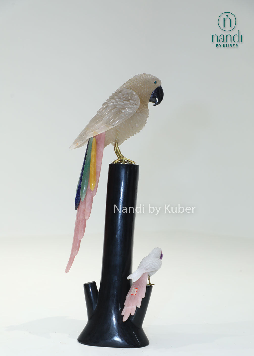 Decorative semi-precious parrot sculpture on a branch-style stand, bringing natural beauty, elegance, and artistic charm to any space.