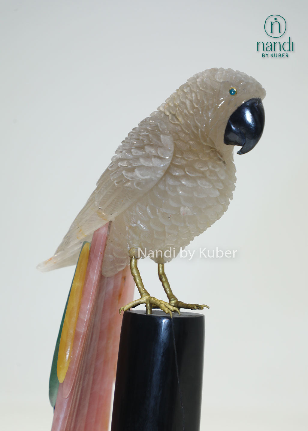 Decorative semi-precious parrot sculpture on a branch-style stand, bringing natural beauty, elegance, and artistic charm to any space.