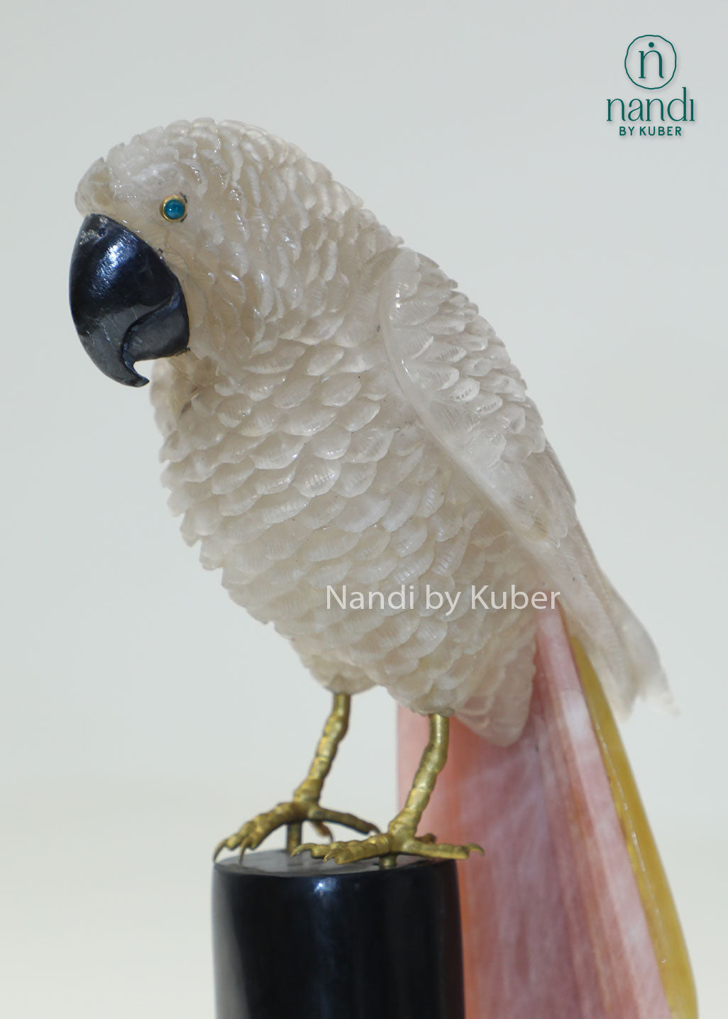Decorative semi-precious parrot sculpture on a branch-style stand, bringing natural beauty, elegance, and artistic charm to any space.