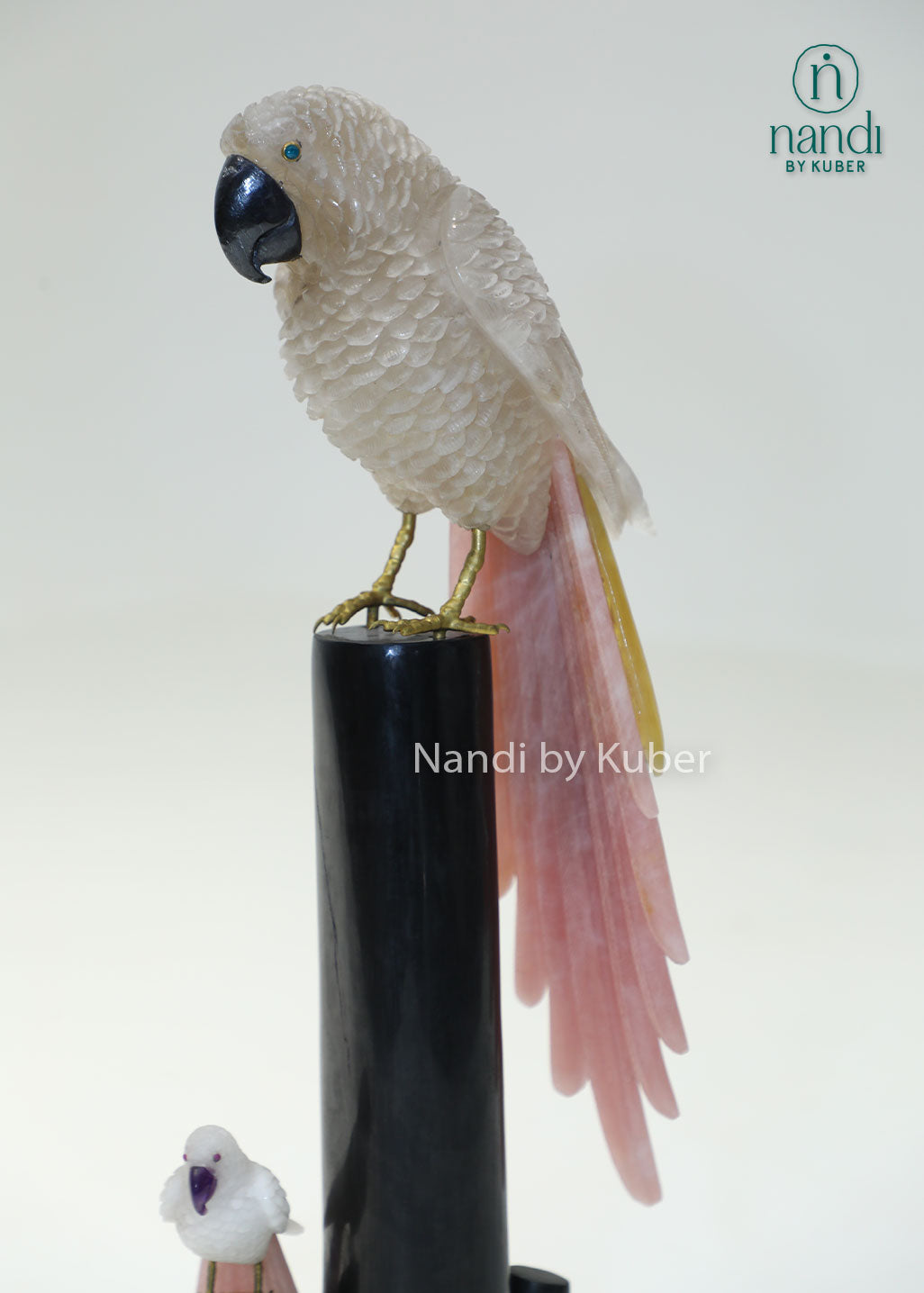 Decorative semi-precious parrot sculpture on a branch-style stand, bringing natural beauty, elegance, and artistic charm to any space.