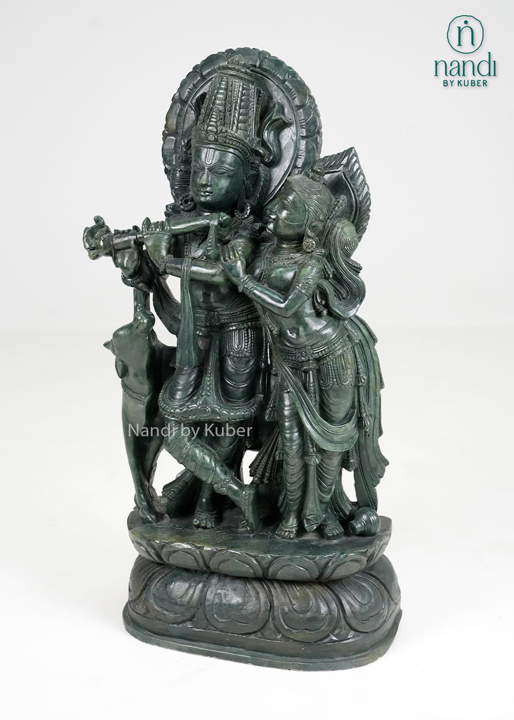 Stone Radha Krishna statue with cow and intricate detailing