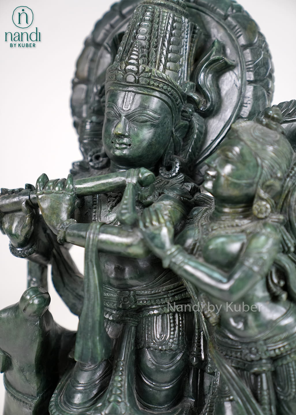 Stone Radha Krishna statue with cow and intricate detailing