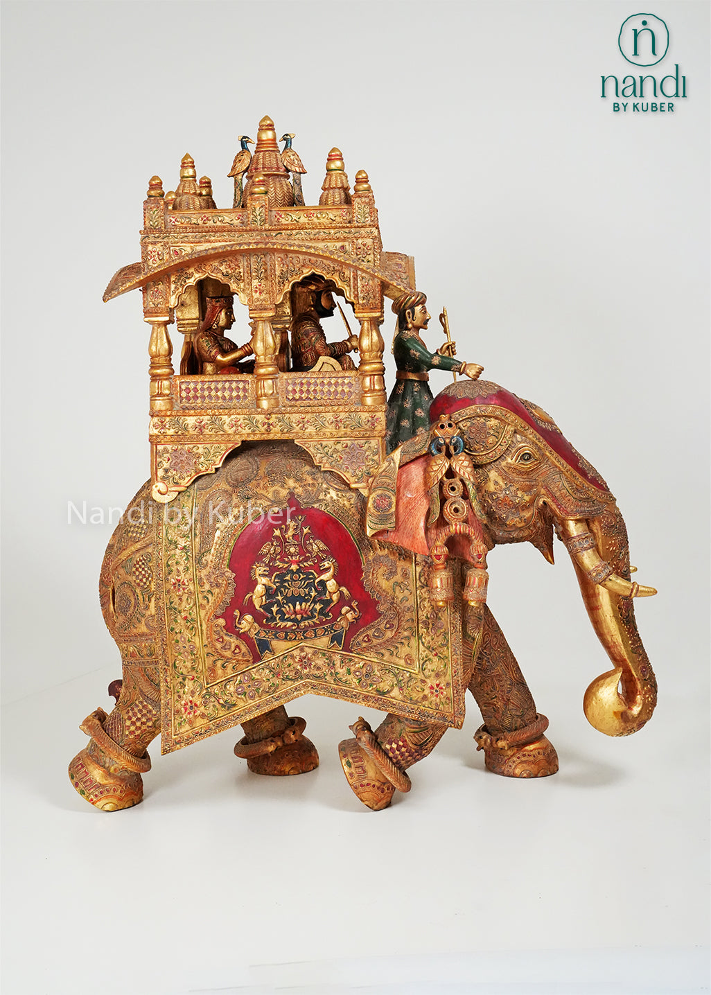Handcrafted elephant ambari statue with intricate embossed carvings, royal canopy, and traditional Indian artwork, ideal for luxury home décor, cultural collections, gifting, and heritage-inspired interiors.