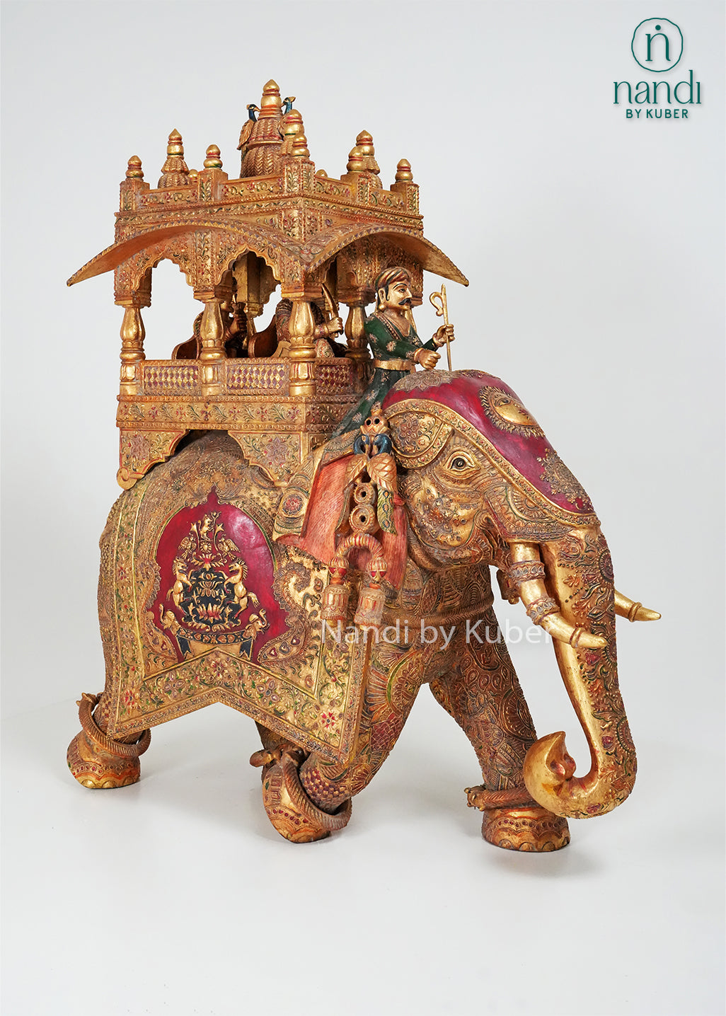 Handcrafted elephant ambari statue with intricate embossed carvings, royal canopy, and traditional Indian artwork, ideal for luxury home décor, cultural collections, gifting, and heritage-inspired interiors.