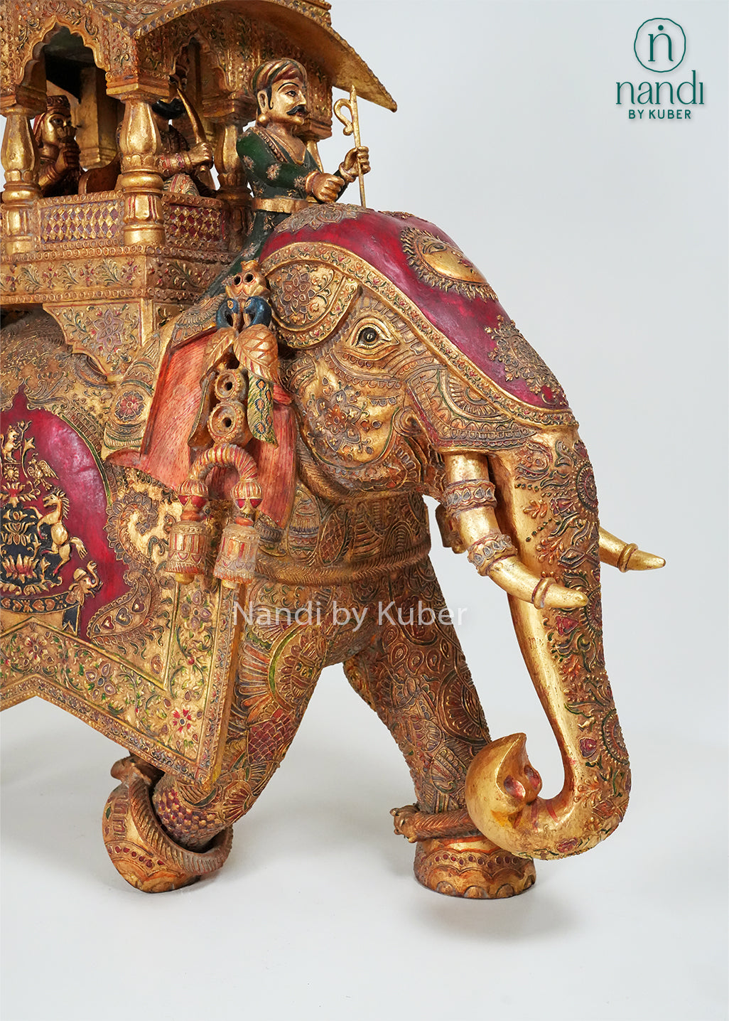 Handcrafted elephant ambari statue with intricate embossed carvings, royal canopy, and traditional Indian artwork, ideal for luxury home décor, cultural collections, gifting, and heritage-inspired interiors.
