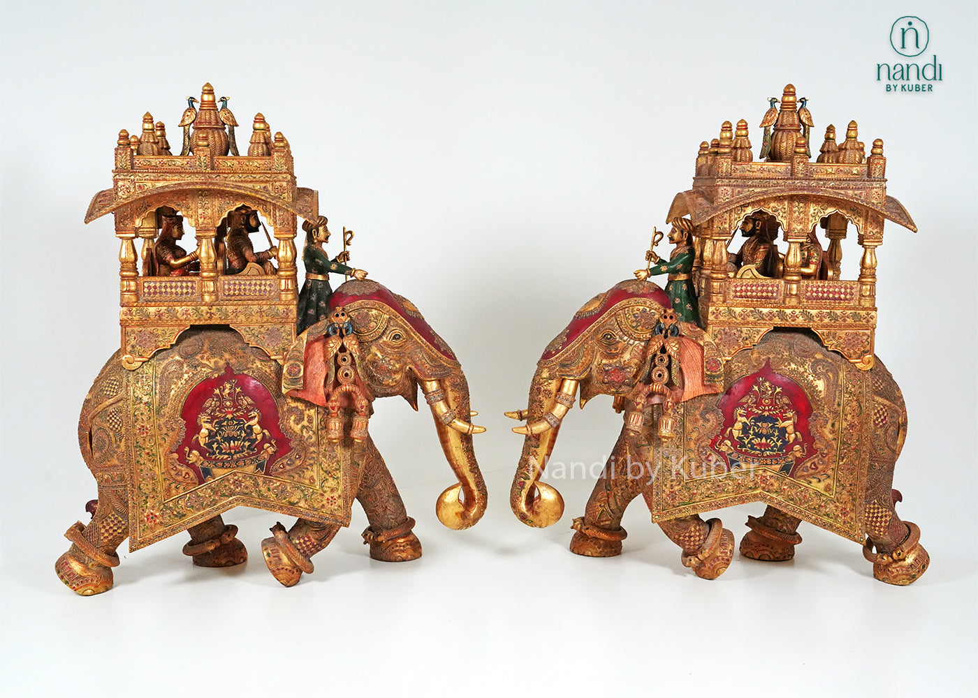 Handcrafted elephant ambari statue with intricate embossed carvings, royal canopy, and traditional Indian artwork, ideal for luxury home décor, cultural collections, gifting, and heritage-inspired interiors.
