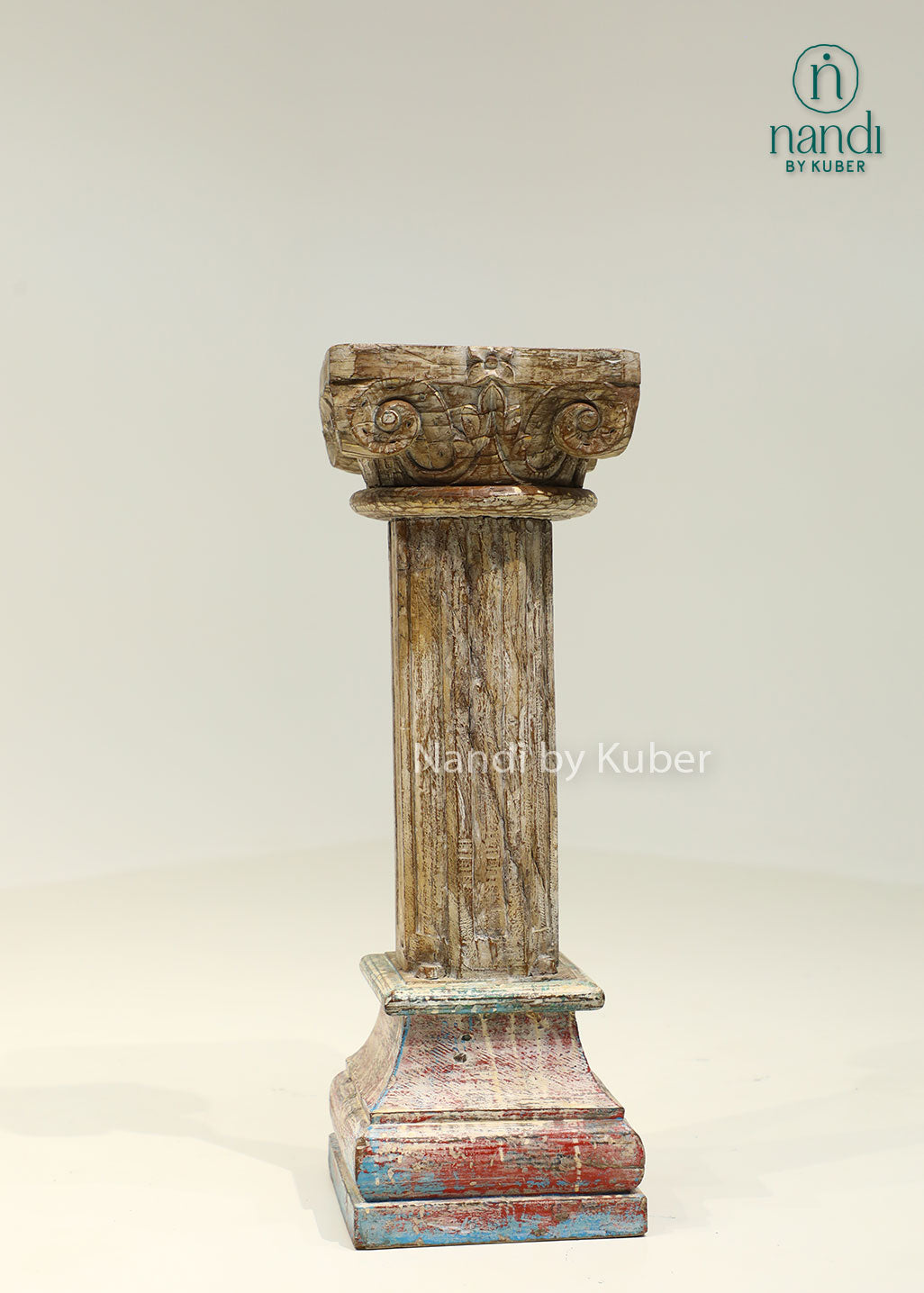 Antique-style handcrafted wooden pillar with distressed detailing and carved accents, perfect for displaying decorative objects and enhancing interior décor.