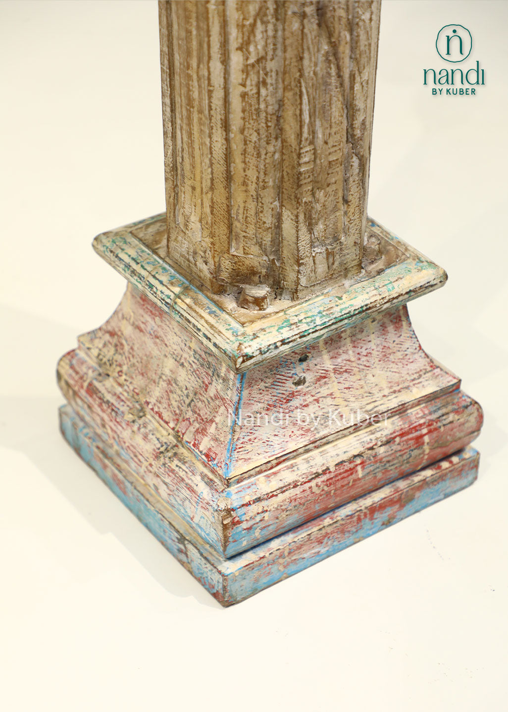 Antique-style handcrafted wooden pillar with distressed detailing and carved accents, perfect for displaying decorative objects and enhancing interior décor.