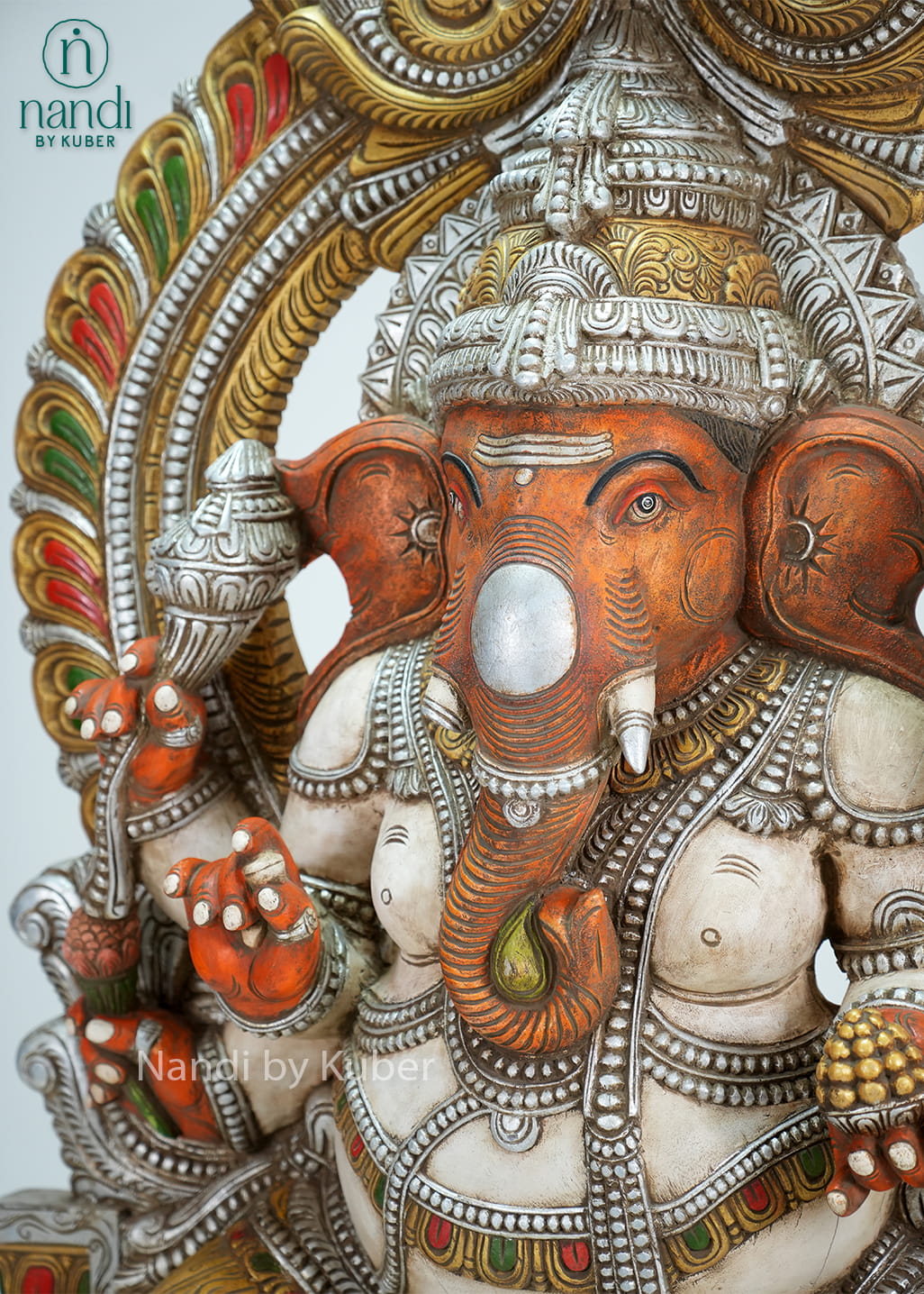 Antique-finish Lord Ganesha statue with ornate arch and throne