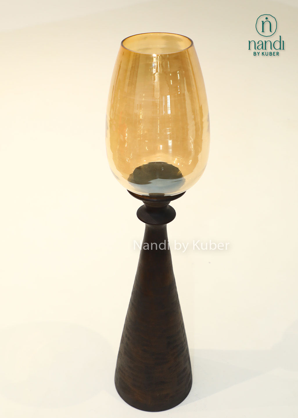 Wooden bottle candle holder with amber glass shade, handcrafted decorative candle stand for home décor, table centerpiece, ambient lighting, festive decoration, rustic interiors, and modern living spaces.