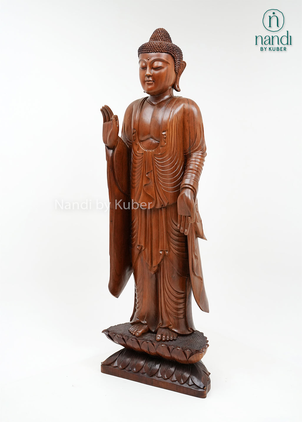 Handcrafted wooden standing Buddha statue with detailed robes, blessing gesture, and lotus base, ideal for meditation spaces, spiritual décor, home interiors, and thoughtful gifting.