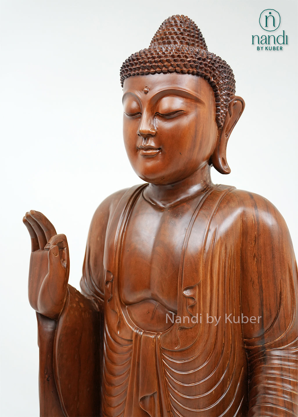 Handcrafted wooden standing Buddha statue with detailed robes, blessing gesture, and lotus base, ideal for meditation spaces, spiritual décor, home interiors, and thoughtful gifting.