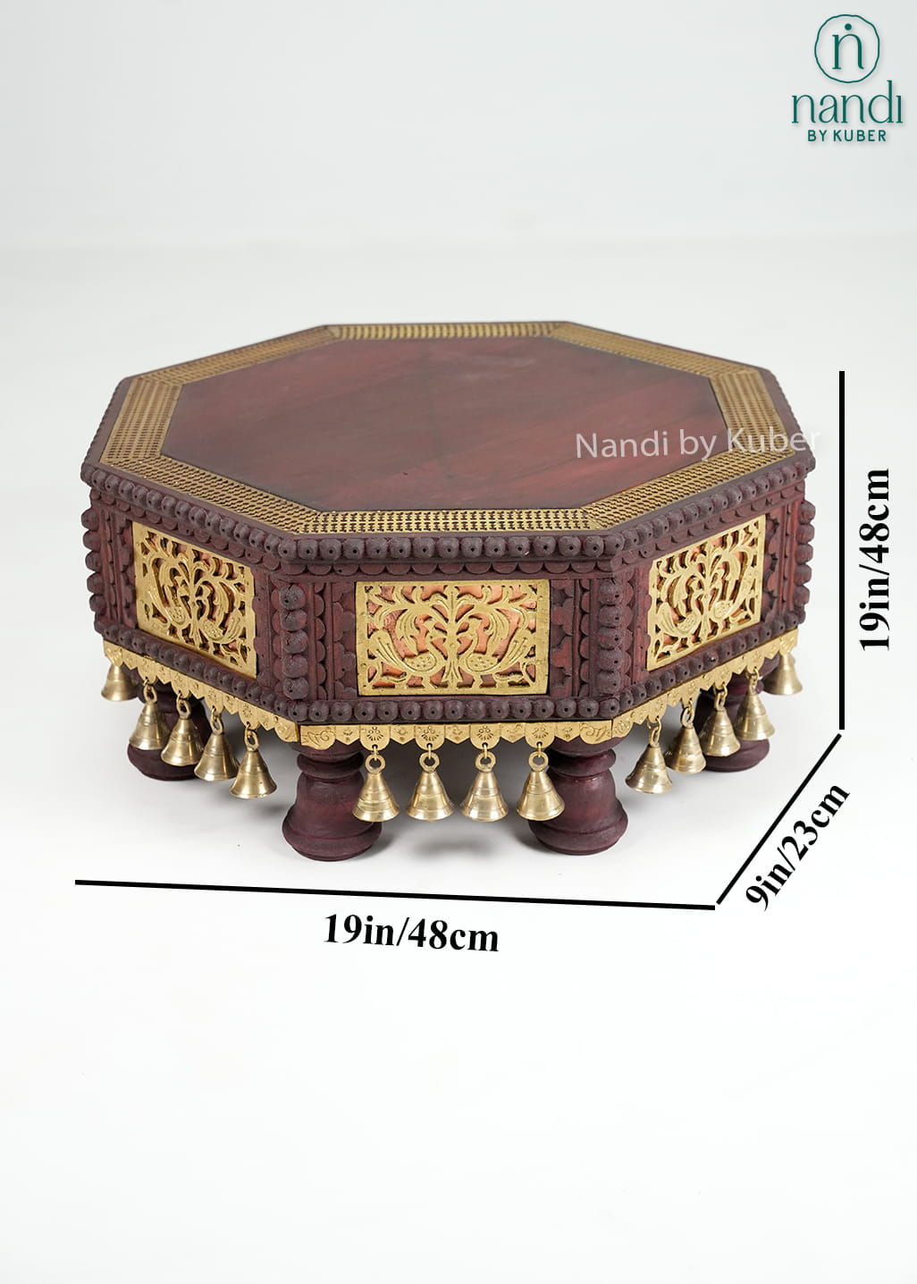 Octagonal wooden pooja chowki with brass detailing and bell accents
