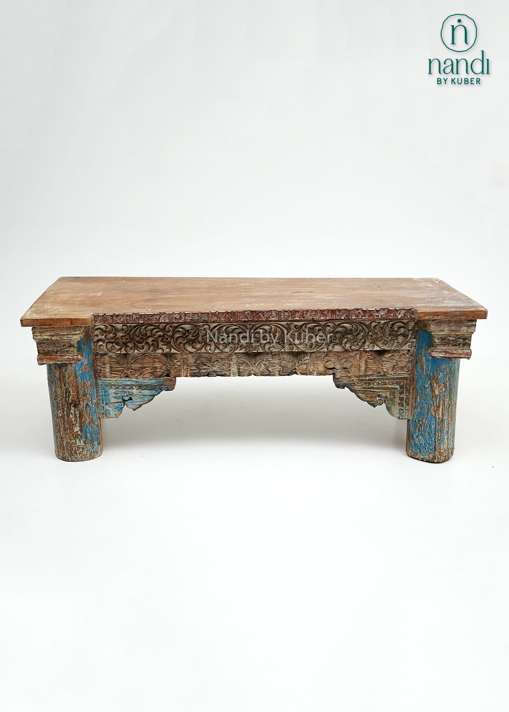 Rustic handcrafted wooden console table with intricate carvings and vintage detailing, perfect for adding character and elegance to any interior space.